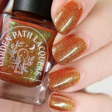 Load image into Gallery viewer, Red holographic microglitter and blue/green shifting shimmer accent a burnt orange jelly base.