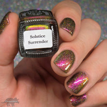 Load image into Gallery viewer, A complex red-bronze to gold to green-blue shifting multichrome nail polish filled with gold holographic microglitter