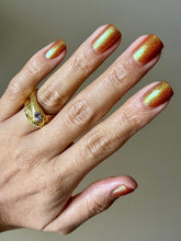 Load image into Gallery viewer, Red holographic microglitter and blue/green shifting shimmer accent a burnt orange jelly base.
