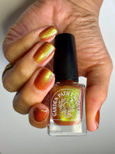Load image into Gallery viewer, Red holographic microglitter and blue/green shifting shimmer accent a burnt orange jelly base.