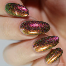 Load image into Gallery viewer, A complex red-bronze to gold to green-blue shifting multichrome nail polish filled with gold holographic microglitter
