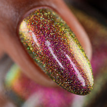 Load image into Gallery viewer, A complex red-bronze to gold to green-blue shifting multichrome nail polish filled with gold holographic microglitter