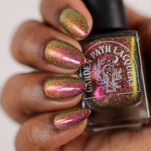 Load image into Gallery viewer, A complex red-bronze to gold to green-blue shifting multichrome nail polish filled with gold holographic microglitter