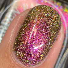 Load image into Gallery viewer, A complex red-bronze to gold to green-blue shifting multichrome nail polish filled with gold holographic microglitter