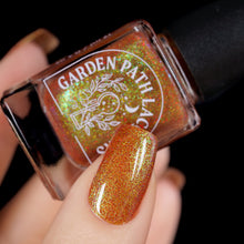 Load image into Gallery viewer, Red holographic microglitter and blue/green shifting shimmer accent a burnt orange jelly base.